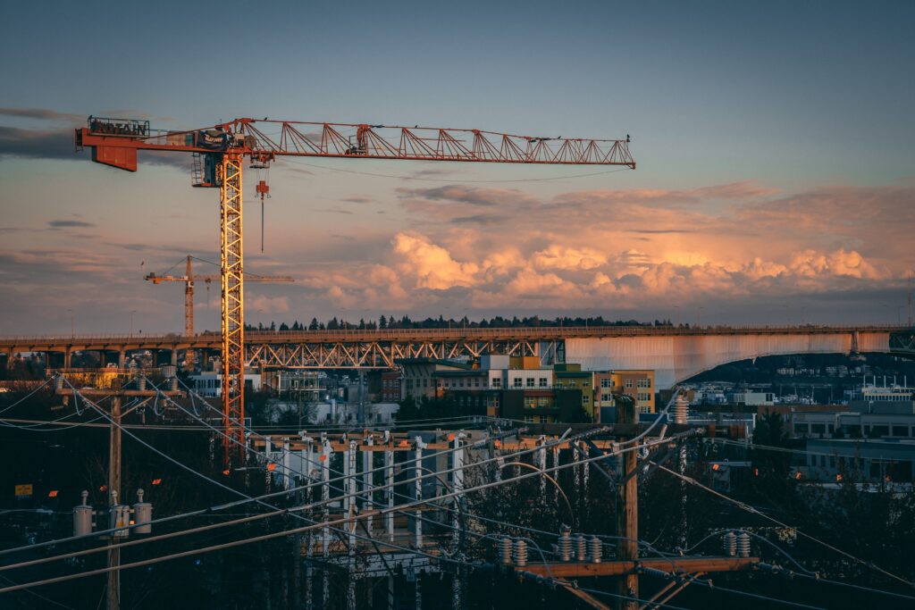 beautiful view of a construction site in a city during sunset